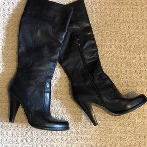 Black leather Guess tall heeled boots.